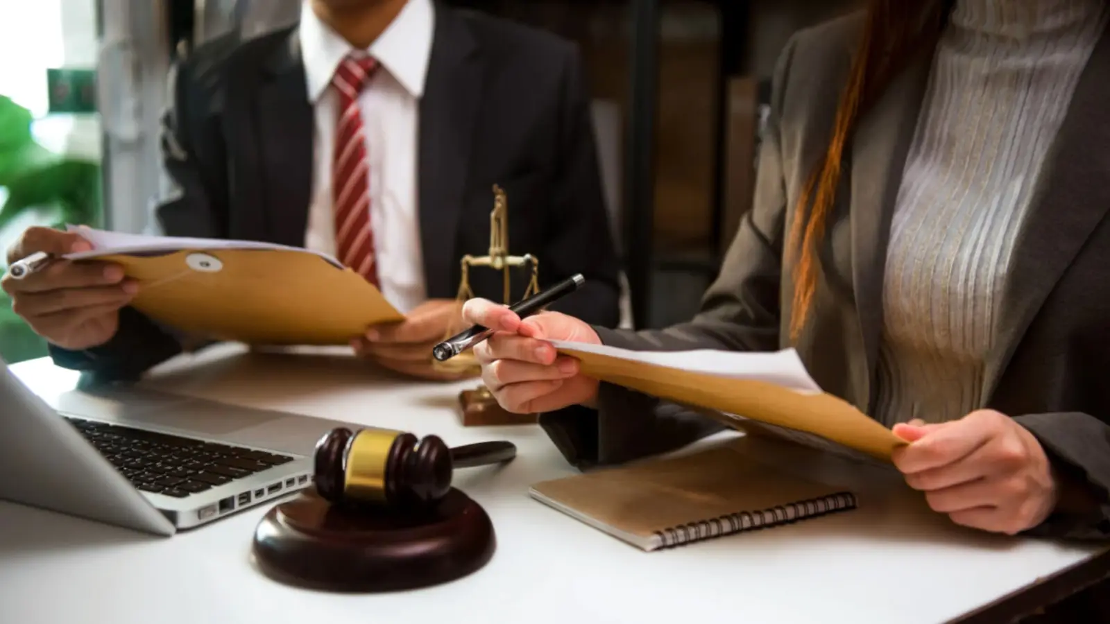 Attorney and client reviewing documents together