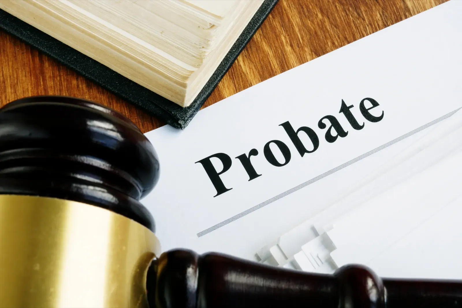 A probate document beside a gavel and law book